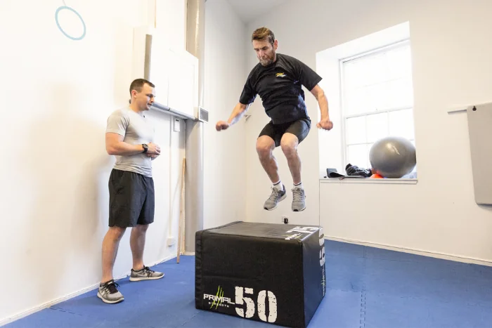 personal training client box jumping