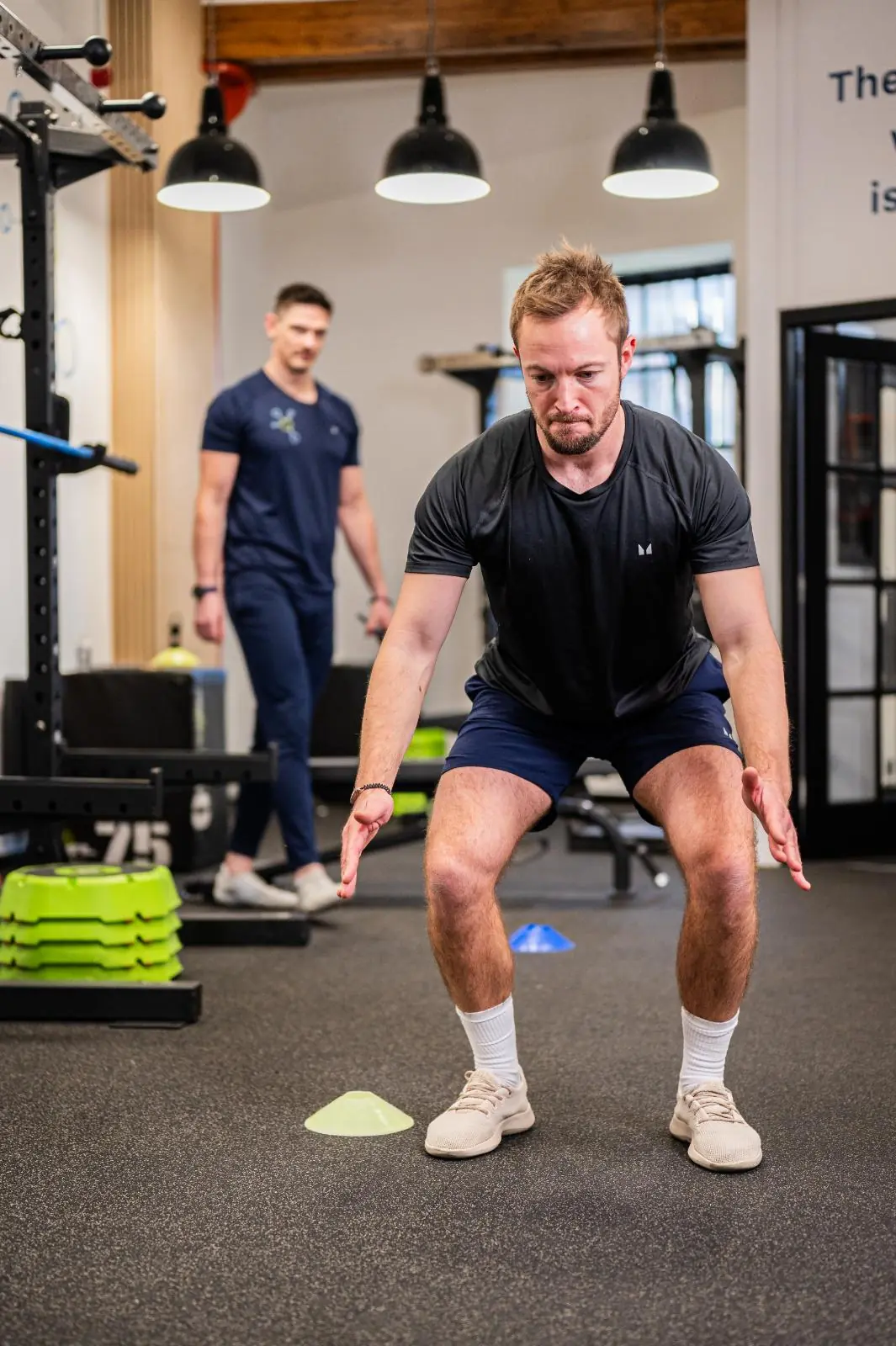 KA2_9311 Health by Science coach monitoring squat mechanics for semi-private personal training Edinburgh and injury prevention in Leith.