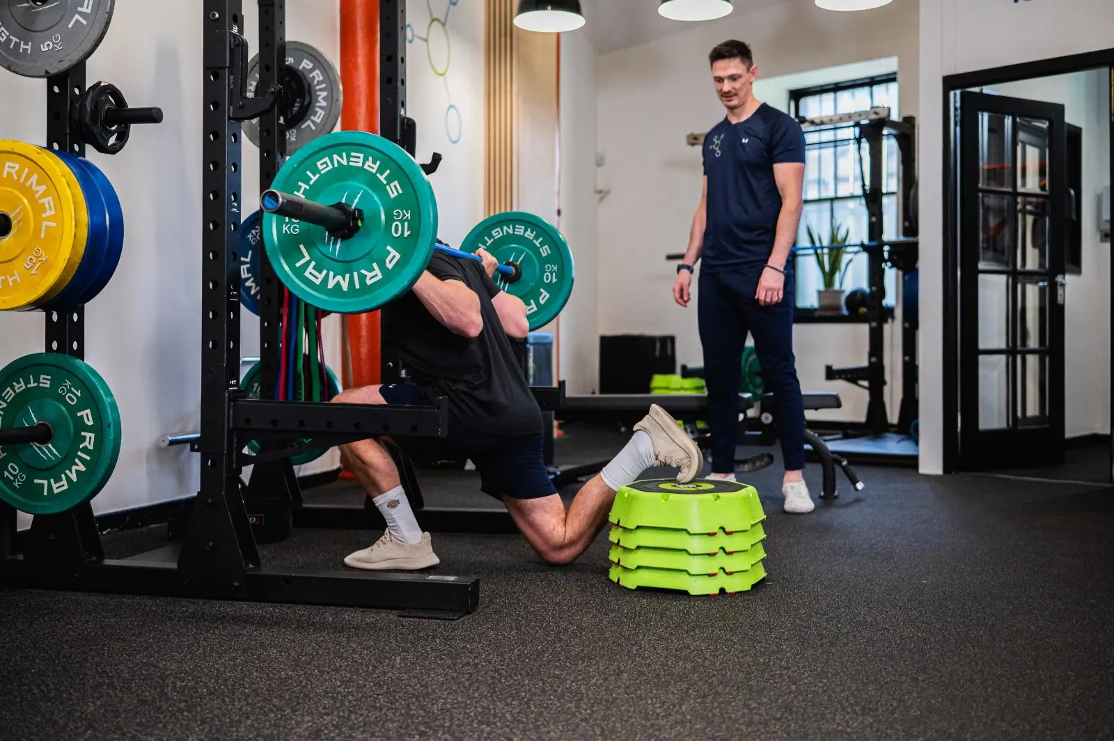 Health by Science coach monitoring lower body stability during personal training Edinburgh sessions in Leith.