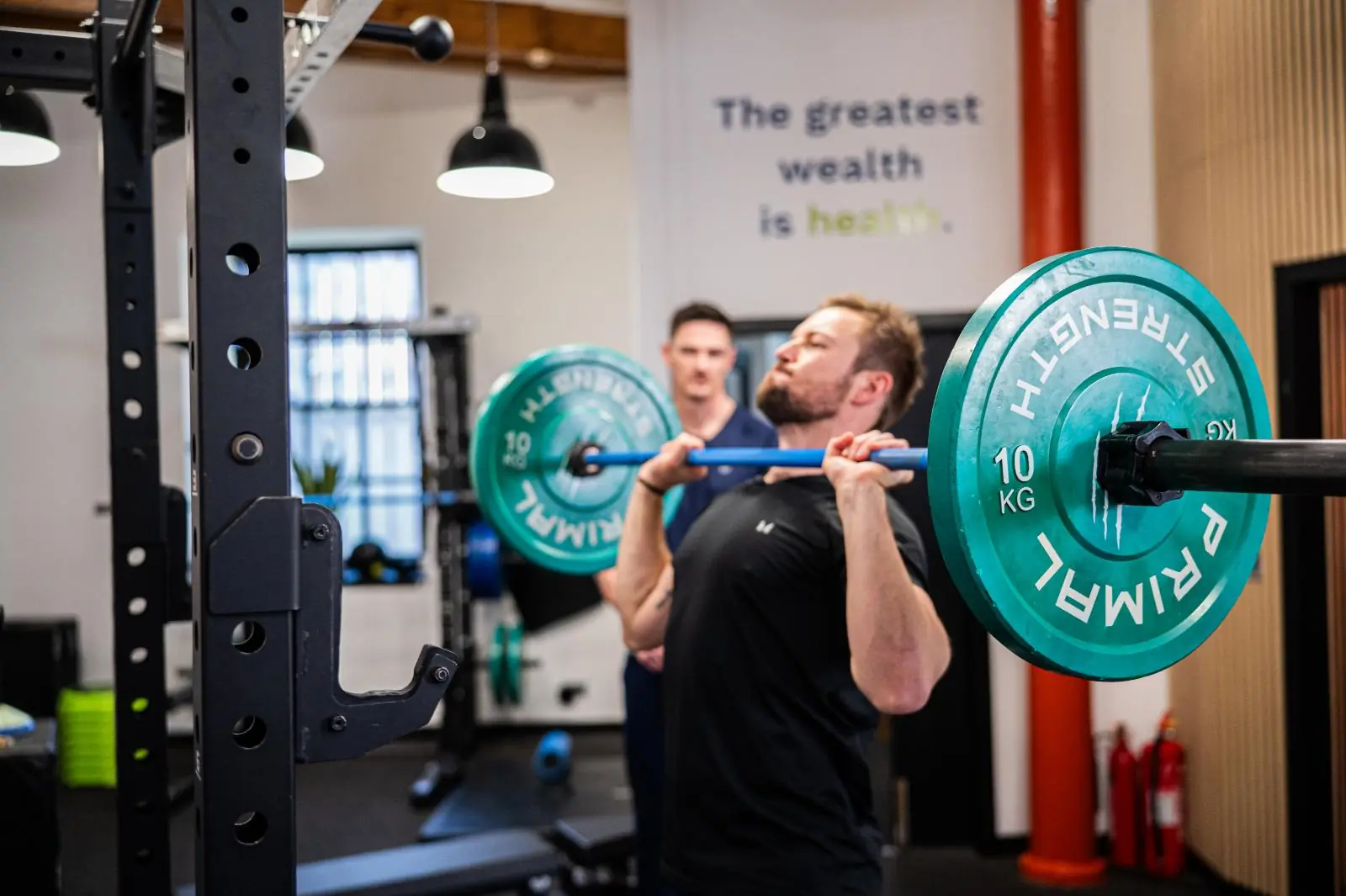 KA2_9478 Health by Science coach monitoring lifting form during a clinical strength and conditioning session for personal training Edinburgh.