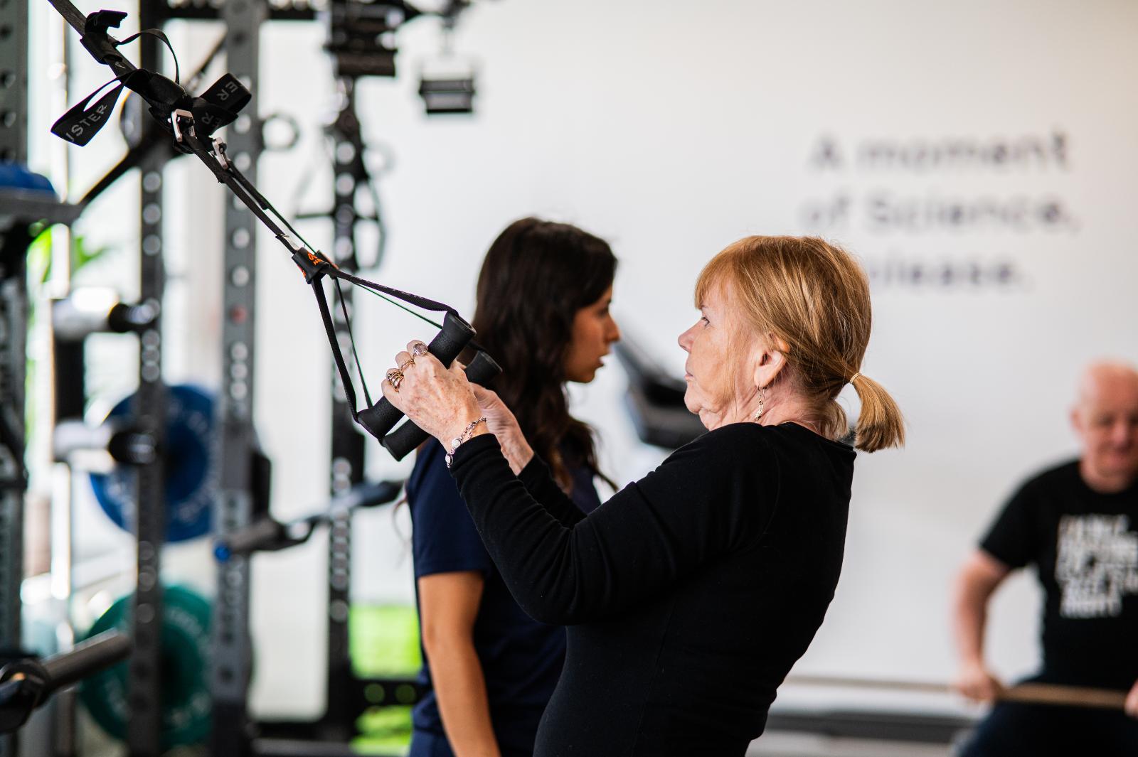 Senior patient performing rehabilitation exercises under clinical supervision for personal training Edinburgh in Leith.