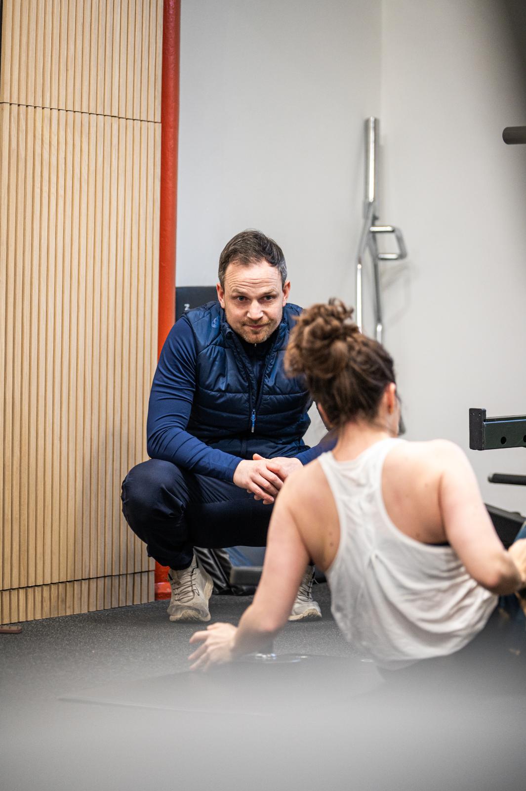 KA2_9715 Health by Science coach providing clinical feedback and encouragement during a rehabilitation-focused personal training Edinburgh session.