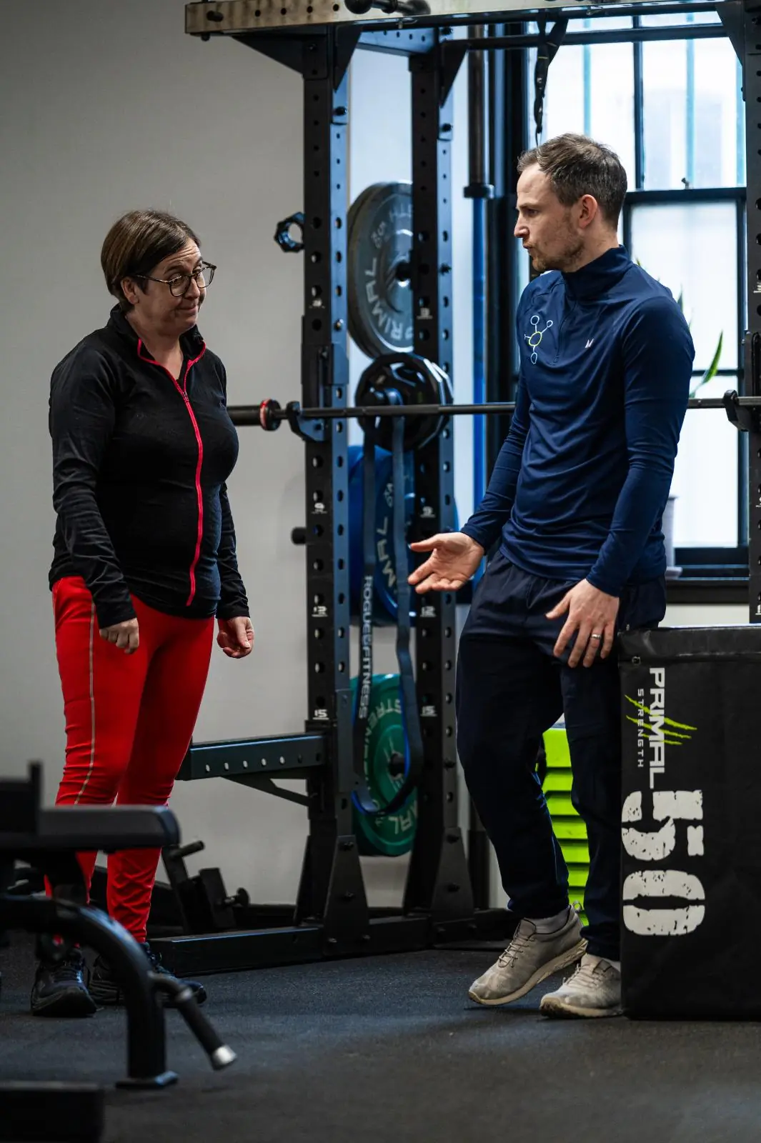 KA2_9738 Professional coaching discussion regarding clinical exercise progressions for personal training Edinburgh at the specialized Leith facility.