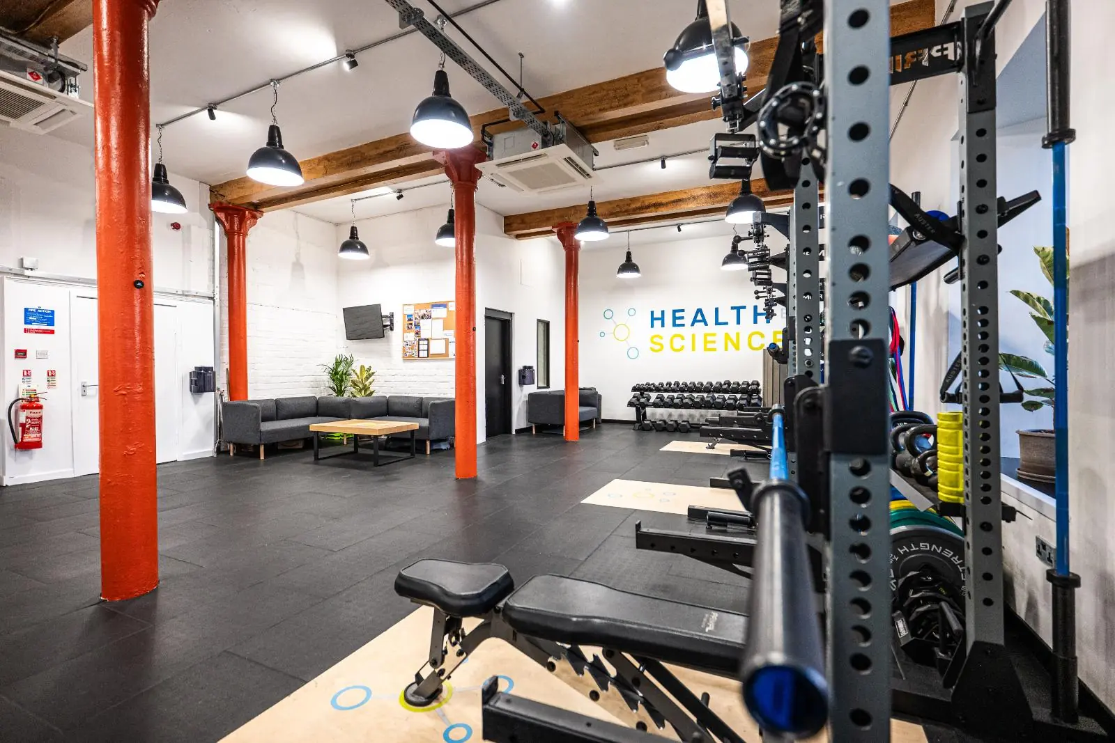 Spacious rehabilitation and personal training Edinburgh facility in Leith, showing a dedicated consultation area and clinical lifting platforms.
