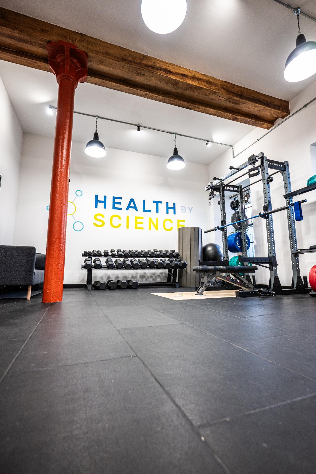 KA3_2043 High-performance dumbbell rack and branding at Health by Science Leith, the premier location for clinical personal training Edinburgh.