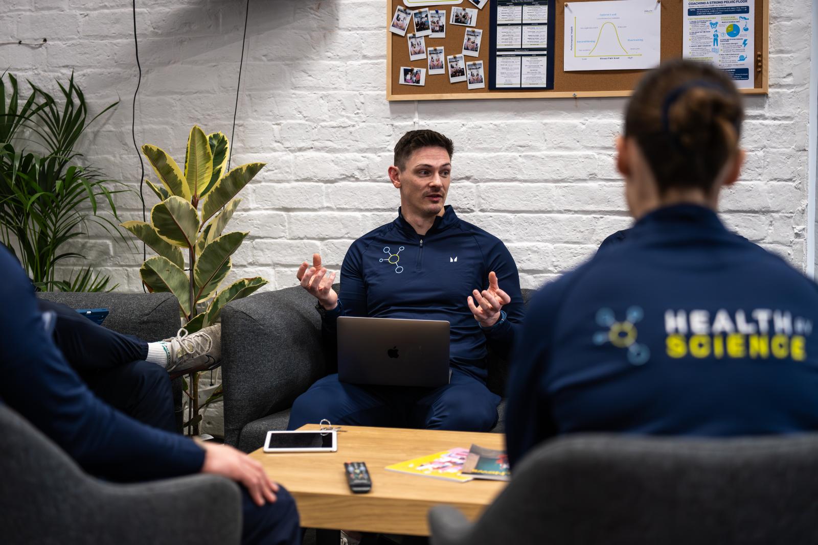 Senior practitioner leading a clinical discussion on patient rehabilitation progress at our specialised Leith facility.