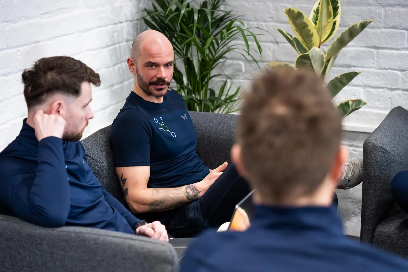 KA3_2190 Health by Science specialists engaged in a clinical peer-review session to discuss evidence-based rehabilitation protocols in Leith.