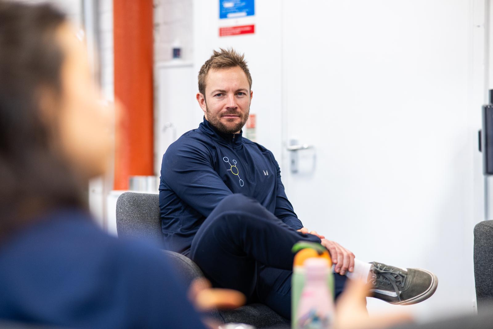 Professional portrait of a Health by Science coach during a clinical team briefing for personal training Edinburgh in Leith.