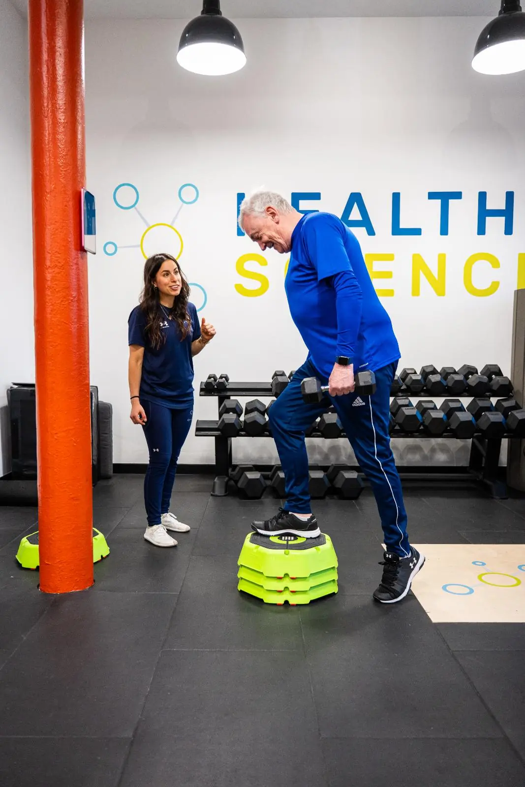 KA3_3065 Specialist providing clinical feedback on stepping mechanics during a personal training Edinburgh session at our specialised Leith facility.
