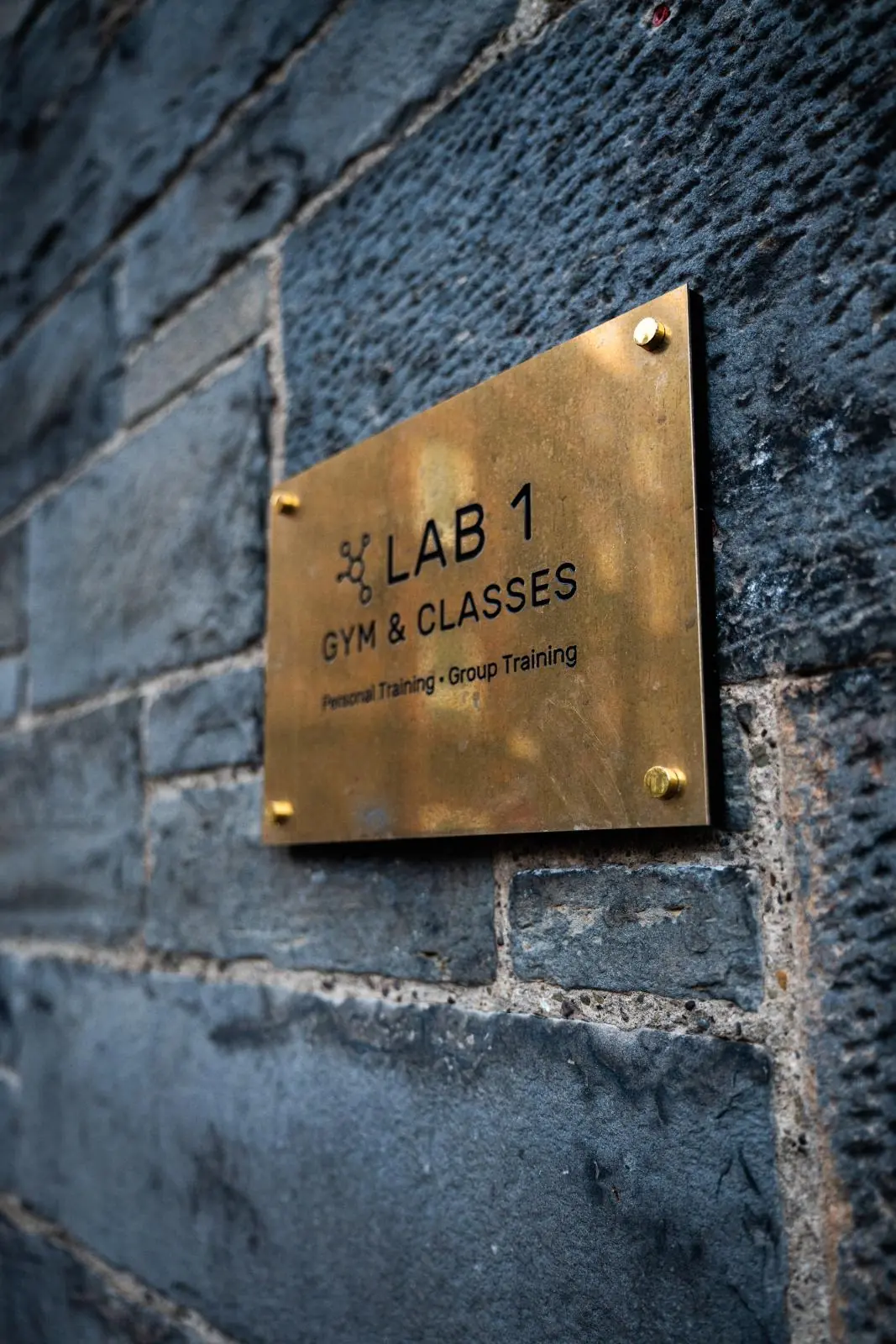 KA3_3640 Professional brass signage for Health by Science Lab 1, specialising in clinical gym classes and personal training Edinburgh.