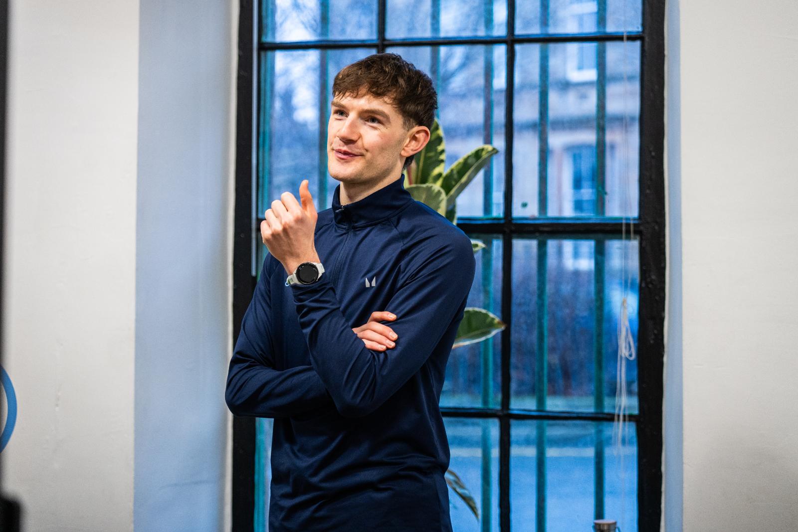 Portrait of a professional Health by Science coach discussing personalised training protocols in our specialised clinical facility.