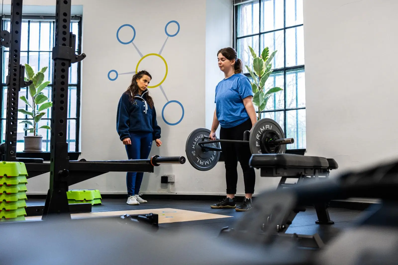 KA3_4439 Professional monitoring of a trap bar deadlift setup to ensure safe hip hinge mechanics for a personal training Edinburgh client.