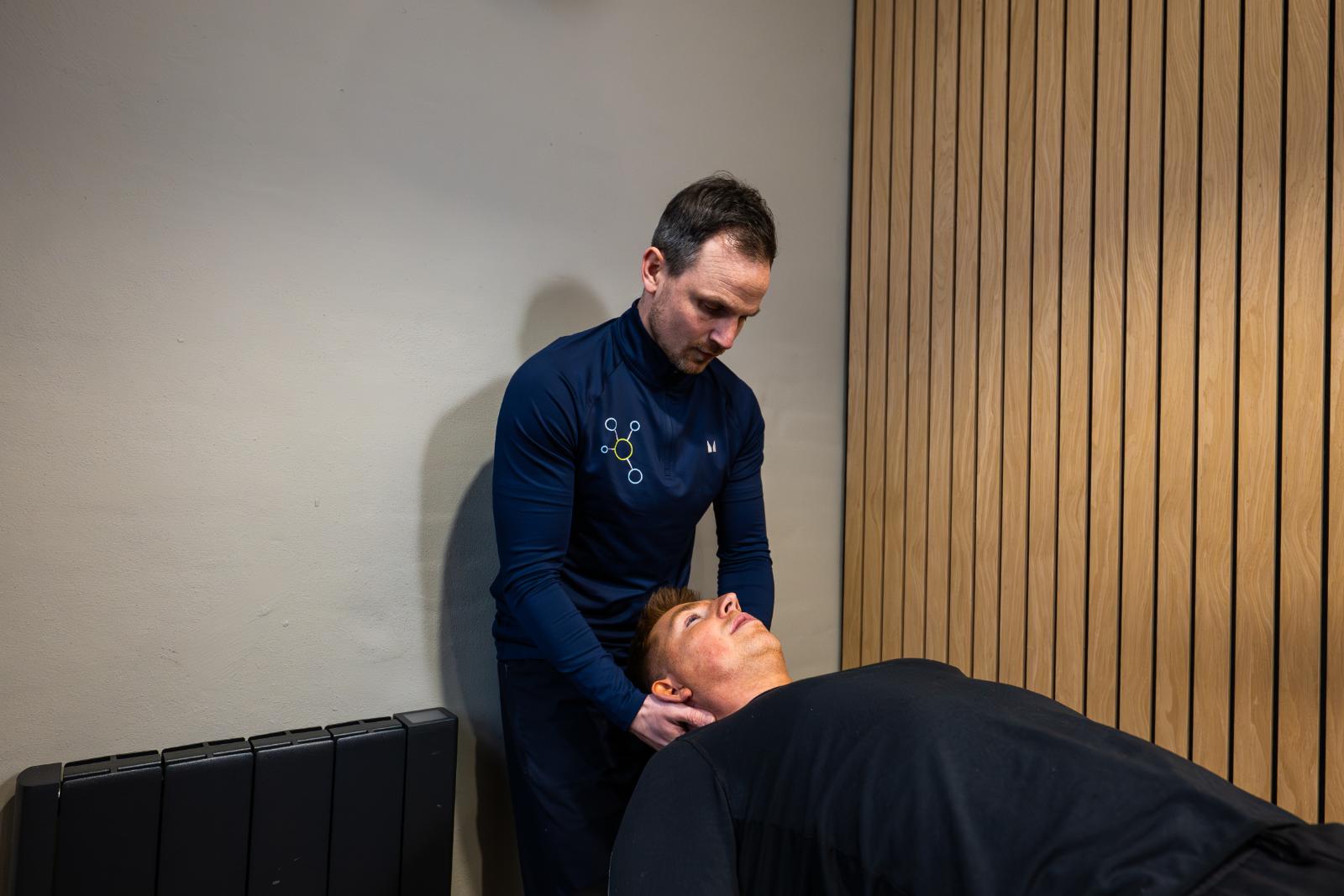 Professional practitioner delivering hands-on physiotherapy treatment to support injury rehabilitation at our specialised Edinburgh clinic.