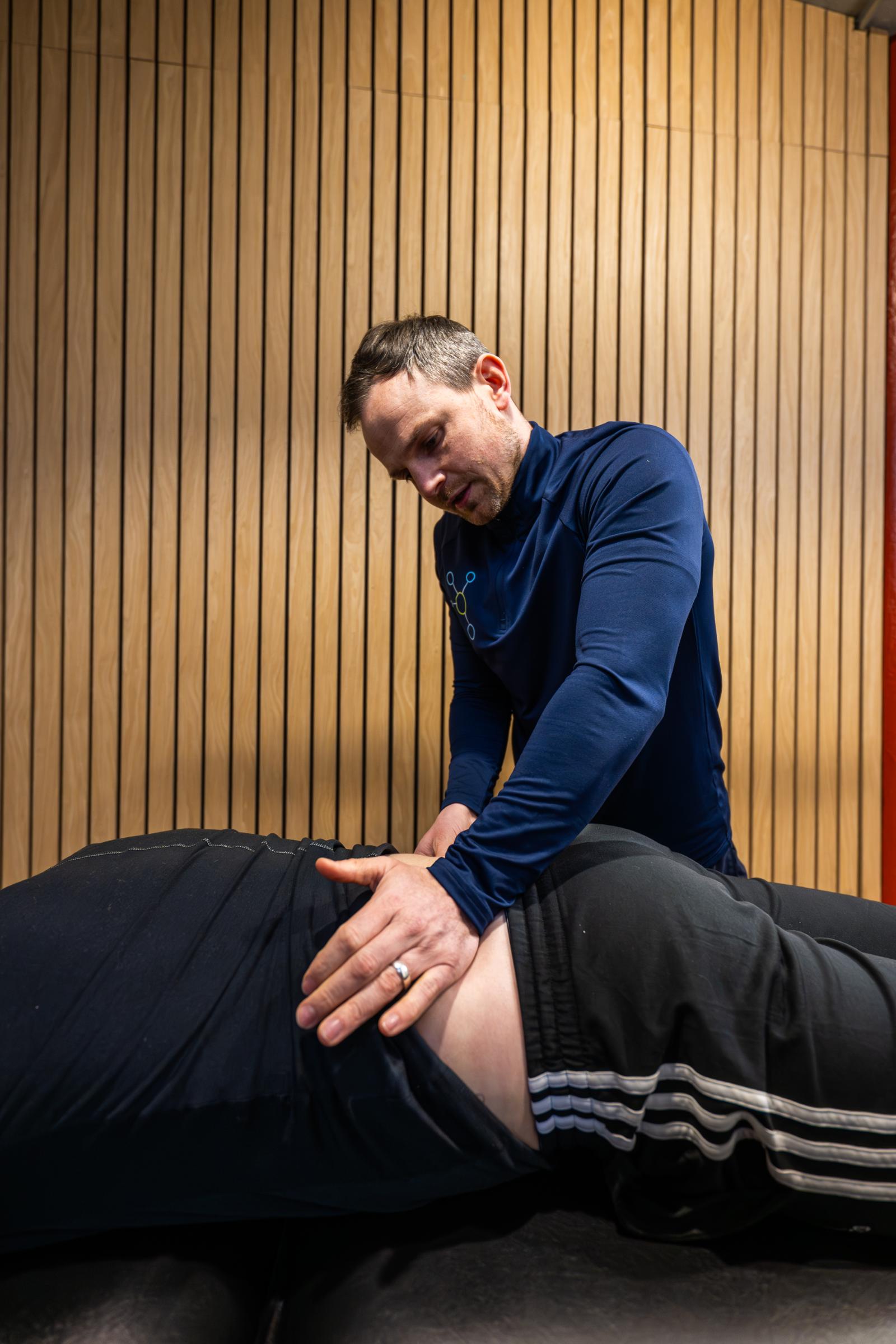 KA3_4807 Health by Science specialist providing hands-on manual therapy for lower back pain management in our Edinburgh clinic.