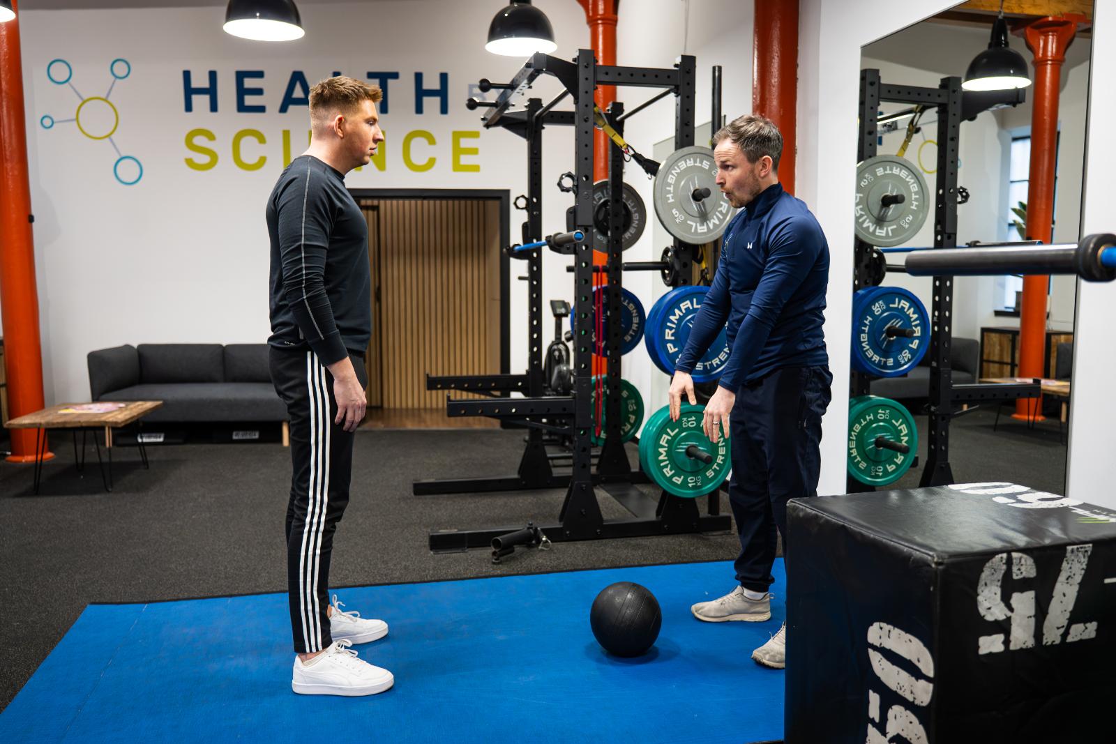 KA3_5121 Clinical movement instruction for a medicine ball slam to improve explosive power and functional coordination in our specialised Leith gym.